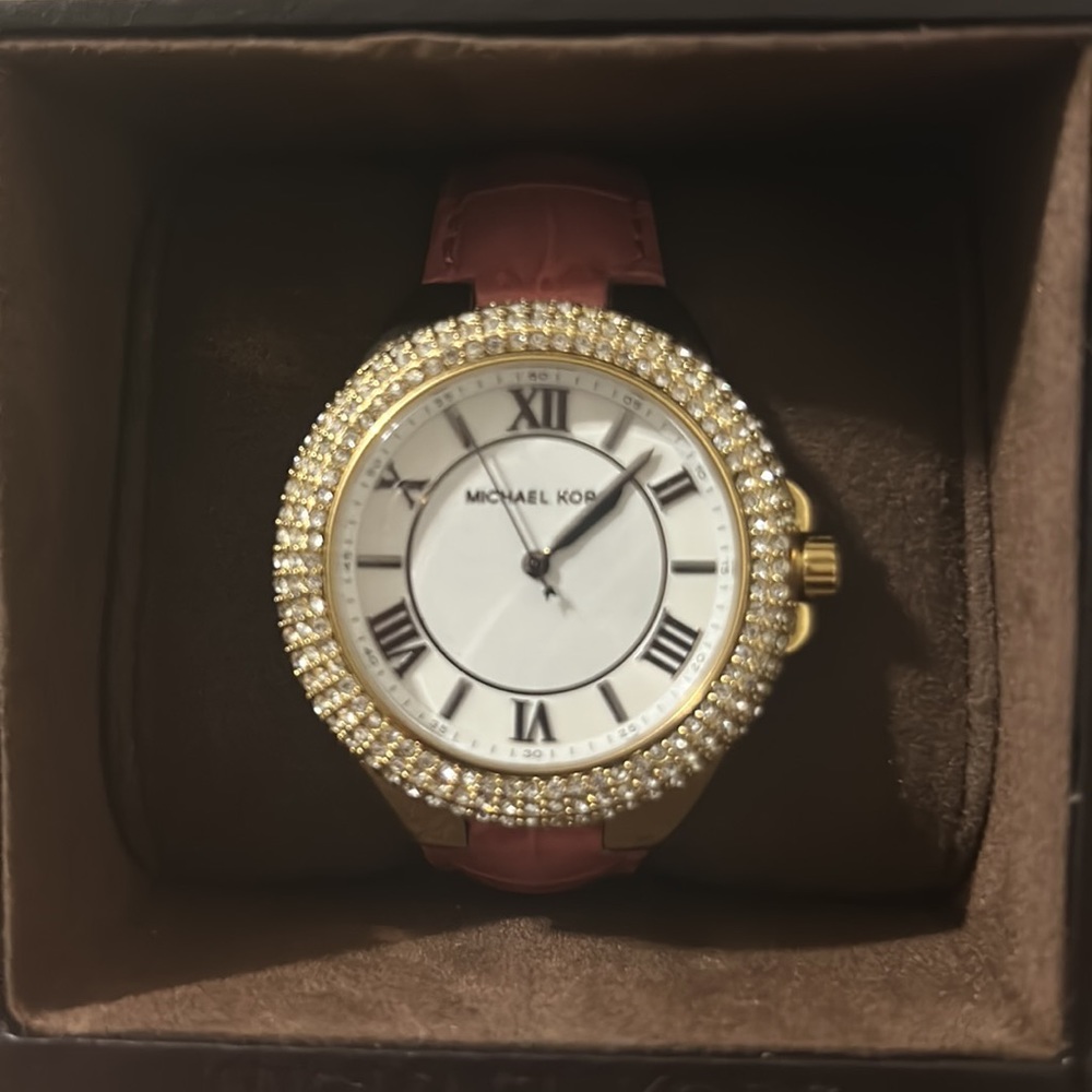 Michael Kors women’s leather band watch.